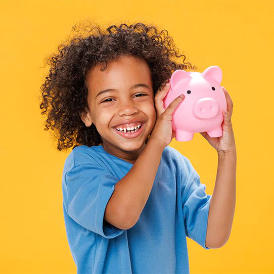 kid holding a piggy bank
