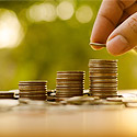 Three stacks of coins, each larger than the previous