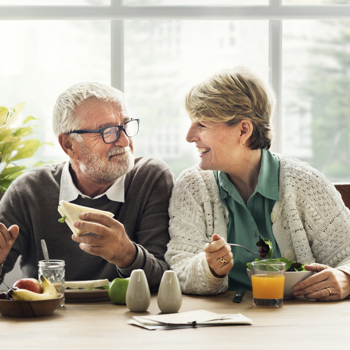 Older couple enjoying breakfast together.